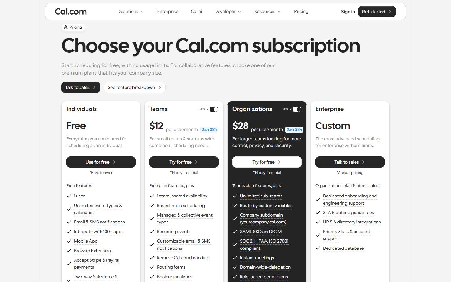 Cal.com's pricing page in its default yearly view, read 27 October 2026, showing a free plan for one user with unlimited event types and calendars, Teams at $12 per user a month with a Save 25% badge and a 14-day free trial, Organizations at $28 per user a month, and custom Enterprise pricing.