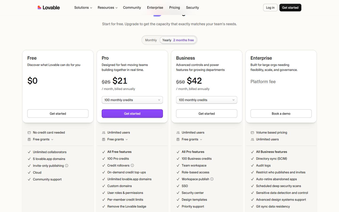 Lovable's pricing page on yearly billing, read 24 October 2026, showing Pro struck through from $25 to $21 a month and Business struck through from $50 to $42 a month, both billed annually.